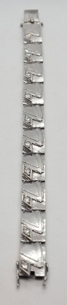 Armbånd i 14 K hvitt gull med 10 diamanter