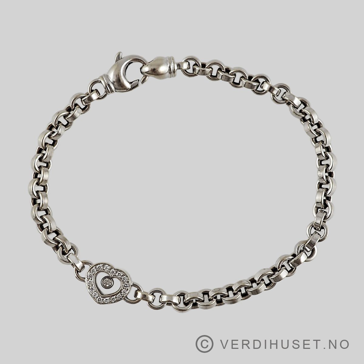 Armbånd i 18 K hvitt gull med hjerte og blanke stener