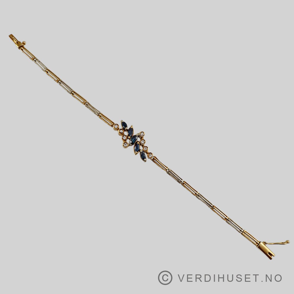 Armbånd i 18 K gull med blå og blanke stener